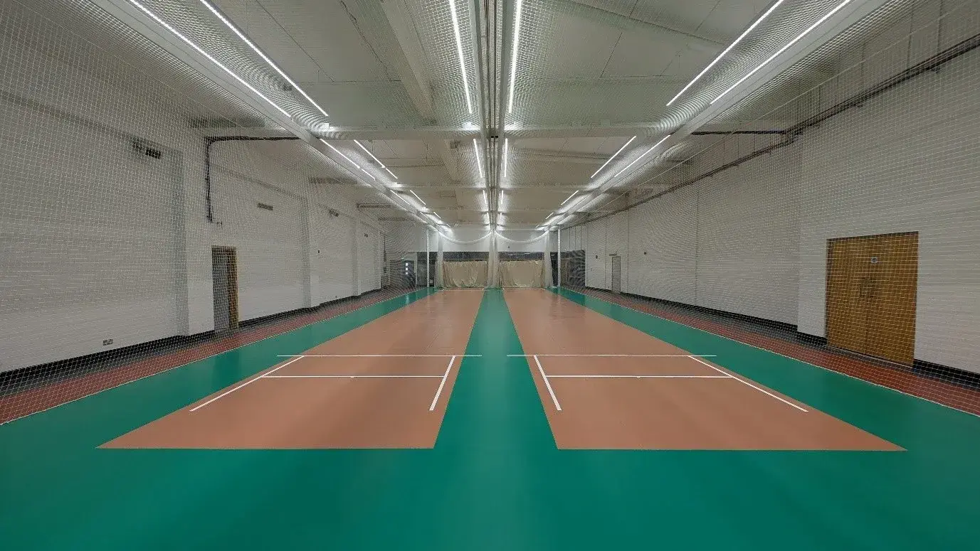 Completed indoor cricket centre at Headingley with green and wood-effect sports flooring