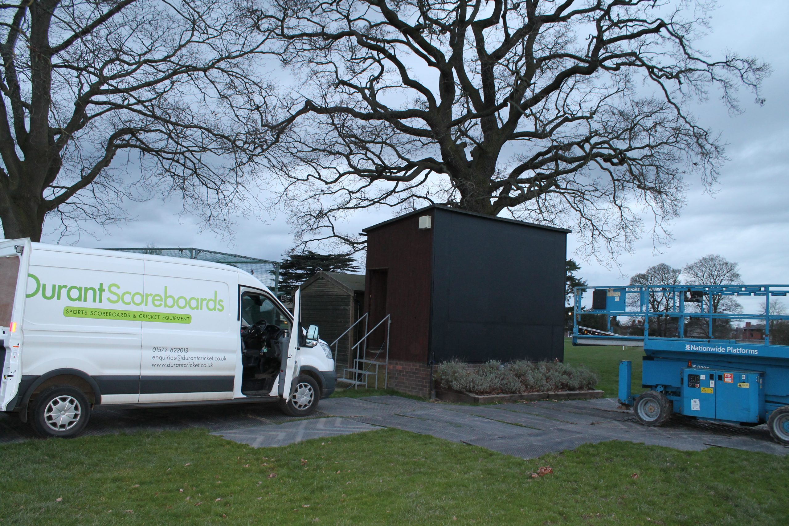 Durant service vehicle beside an outdoor video screen